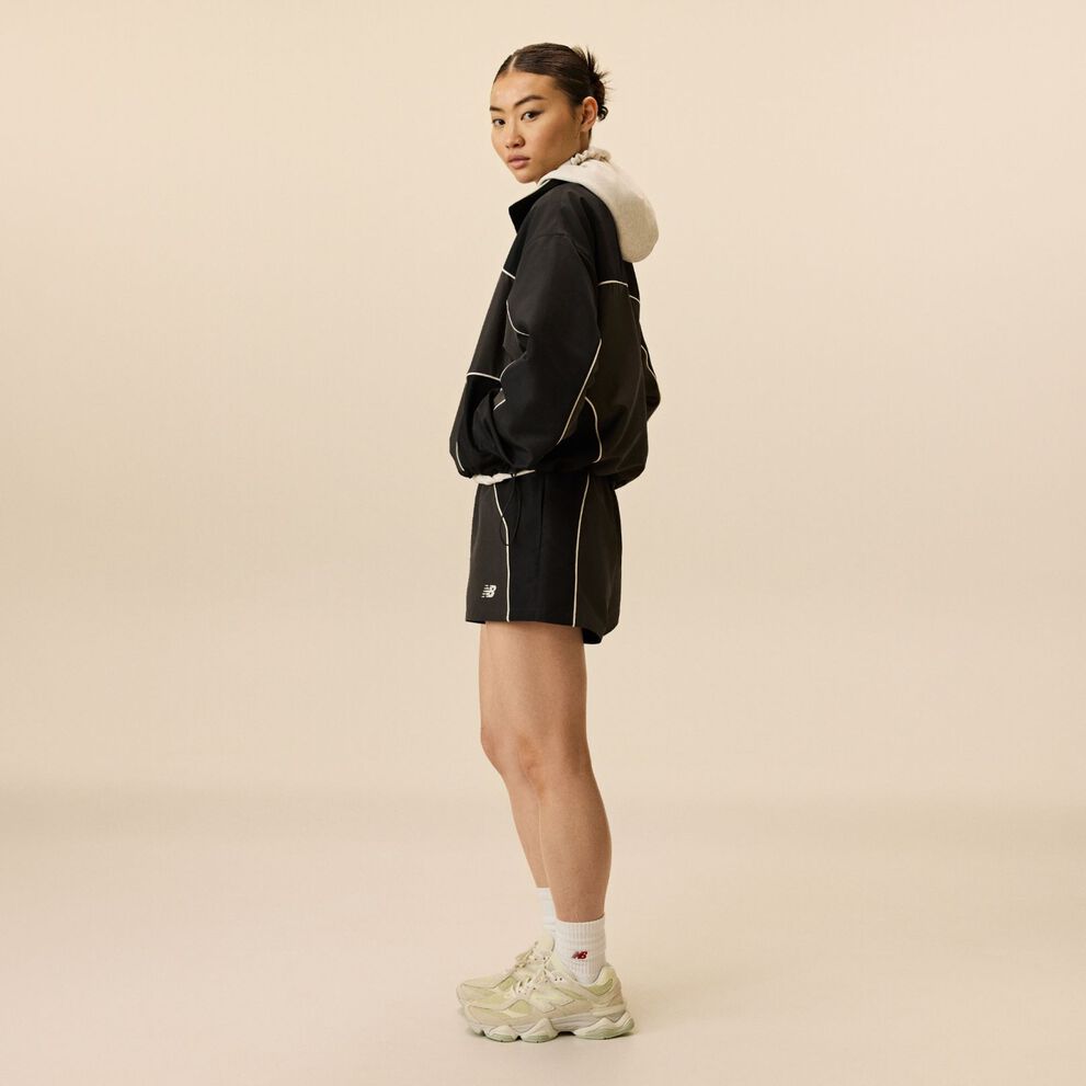 A person wearing 9060 shoes.